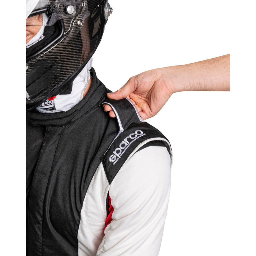 Racing suit zipper area with Sparco logo on black and white suit