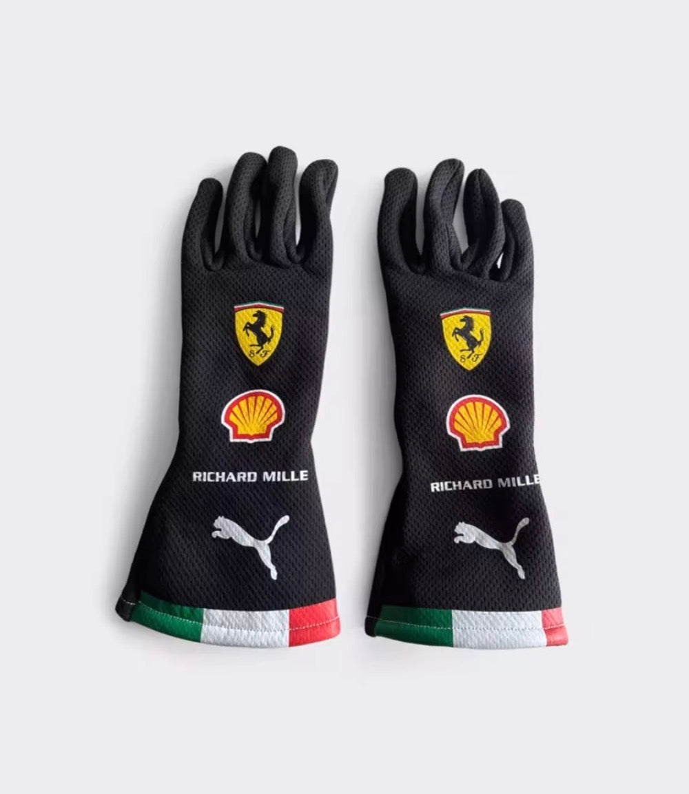 Black racing gloves with Ferrari shield, Richard Mille text, Puma logo, multicolor cuff