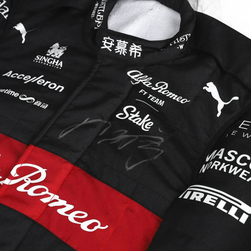 Black racing suit close-up with Alfa Romeo script, Puma logo and red sponsor stripe