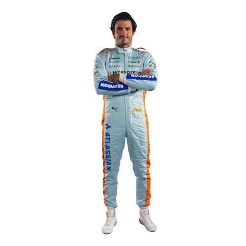 Light blue racing jumpsuit with orange side stripes and printed sponsor logos; full-body front view