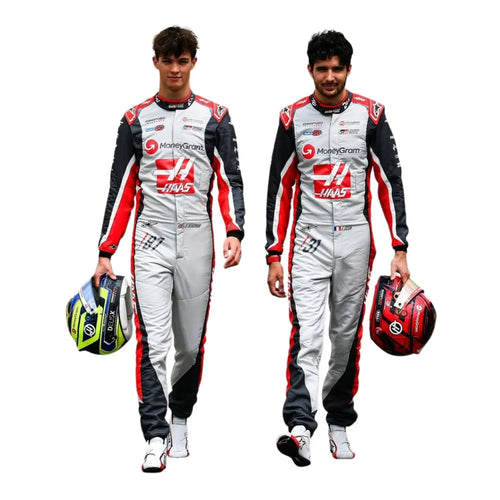 Two racing driver suits with white base, red accents, and black sleeves, each holding gear