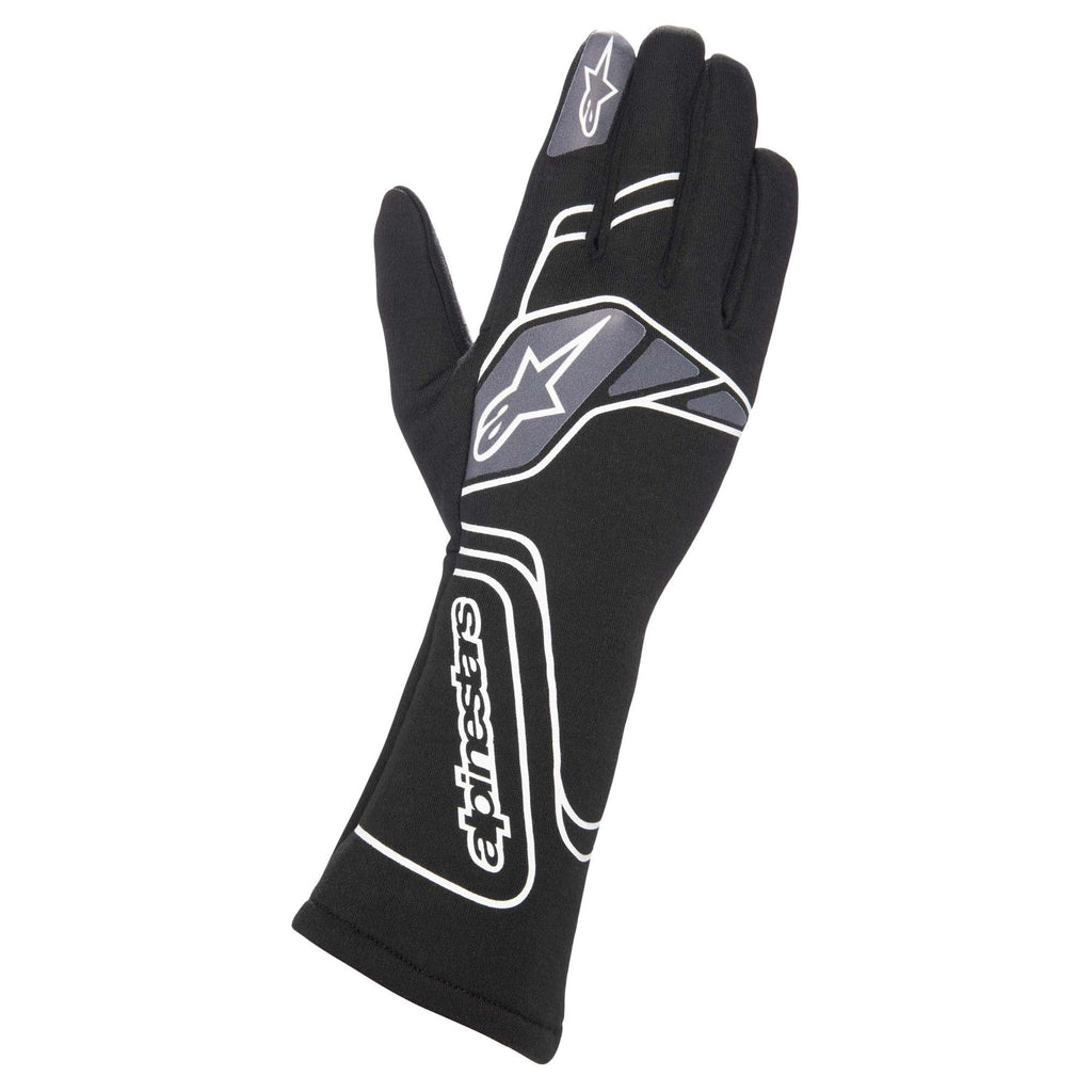 Black motorcycle riding gloves with white Alpinestars logos and padded knuckles