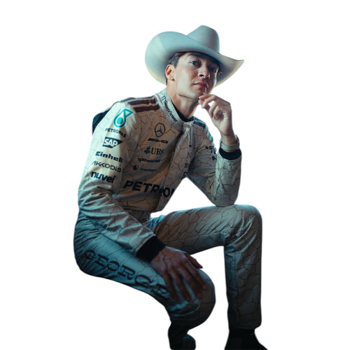 Teal quilted racing suit with a light wide-brim hat, kneeling pose.