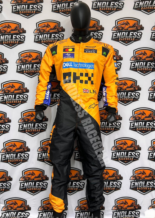 Orange and black racing suit with sponsor panels, boots and gloves, full-body standing view.