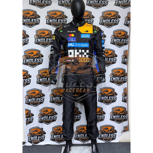 Racing suit on mannequin, black with yellow chest panel and sponsor logos, full body