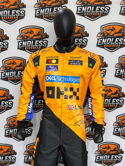 Orange and black racing suit with sponsor logos, star accents, gloves, black head cover.