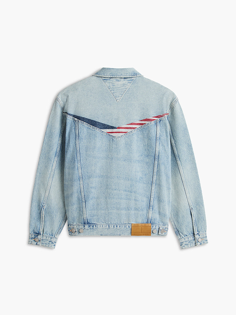 Back of light blue denim jacket with red, white, and navy V-shaped graphic