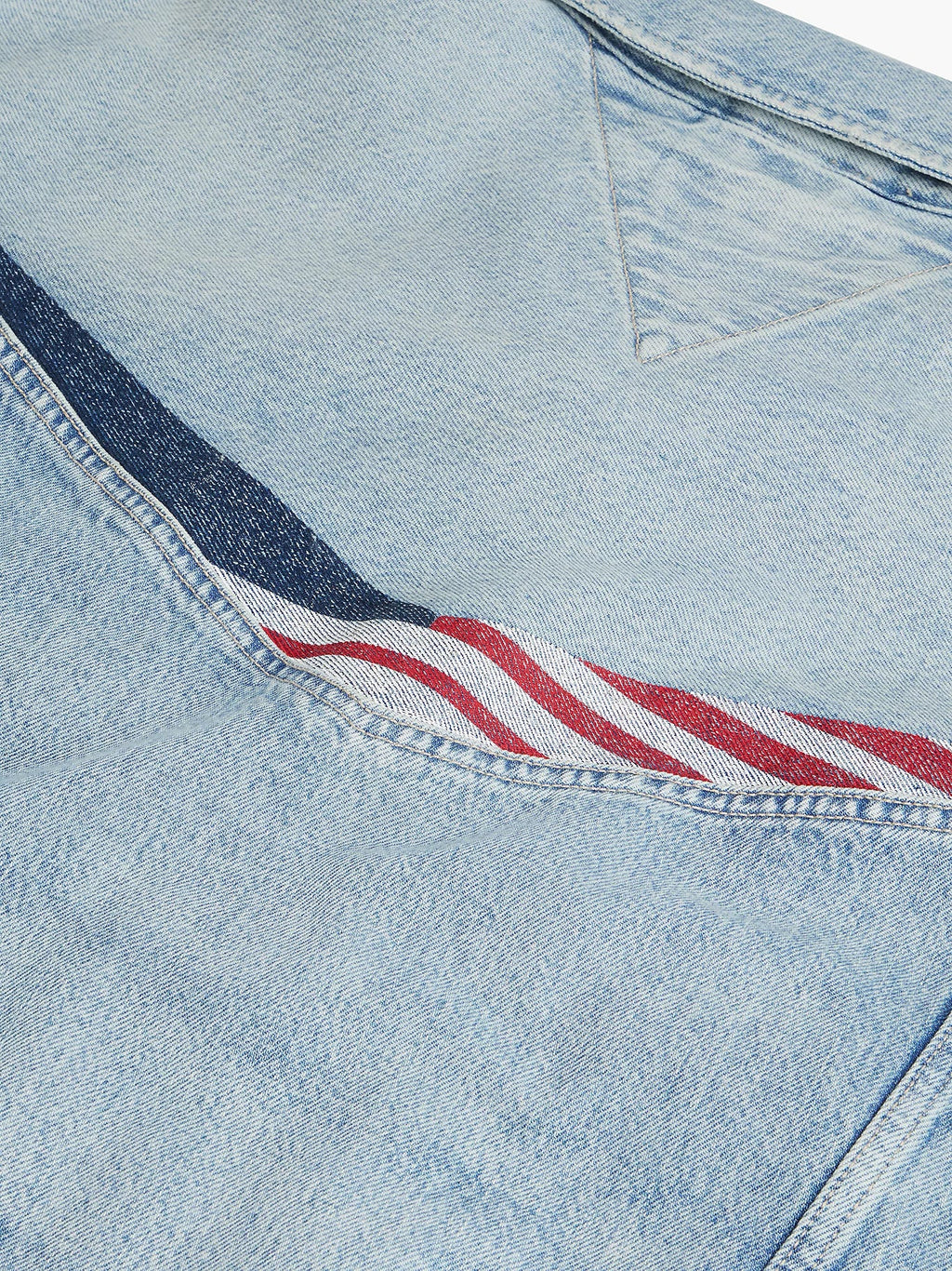 Close-up of red, white, and navy graphic across the denim jacket back