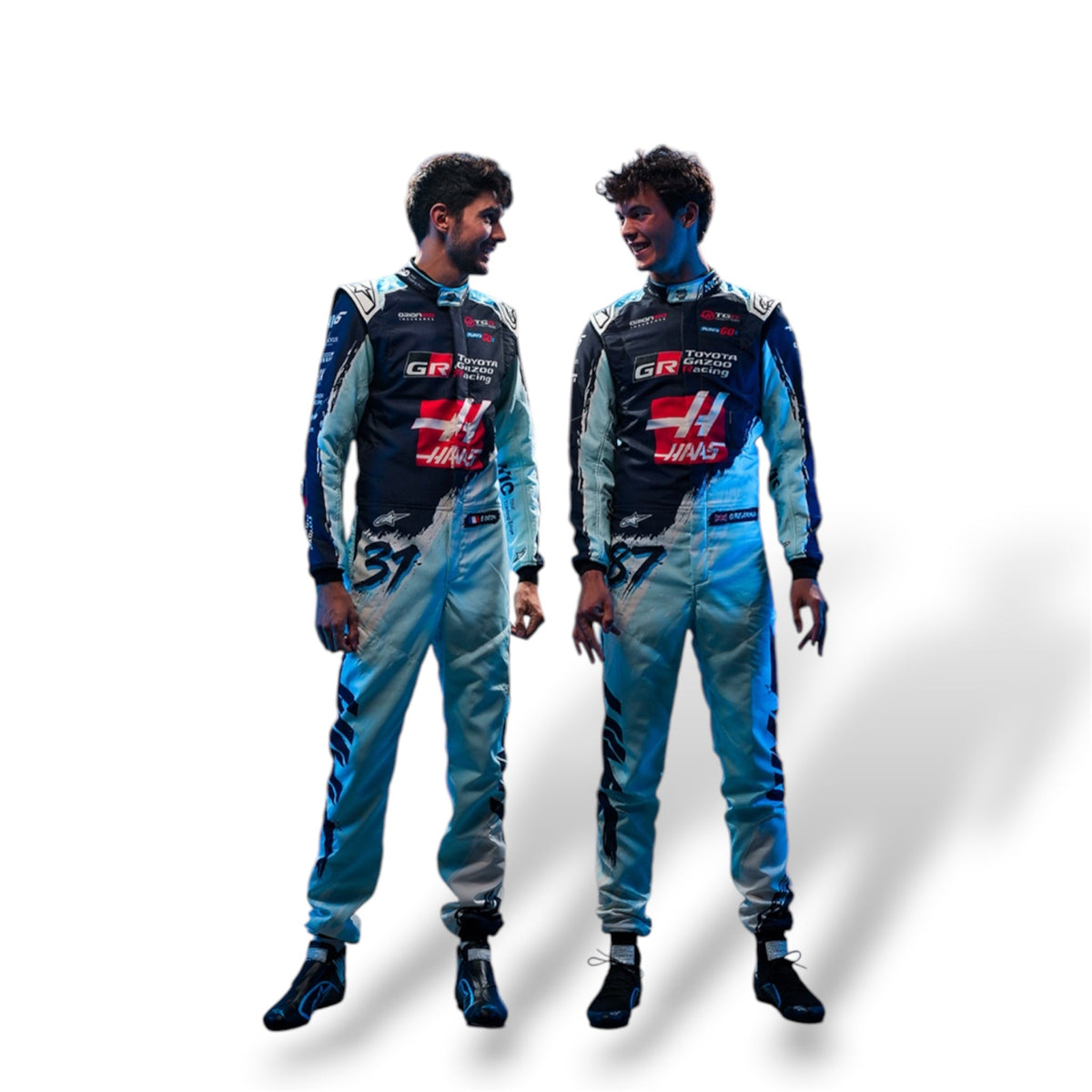 Haas F1 race suit in black, white and blue, shown full-length on two models