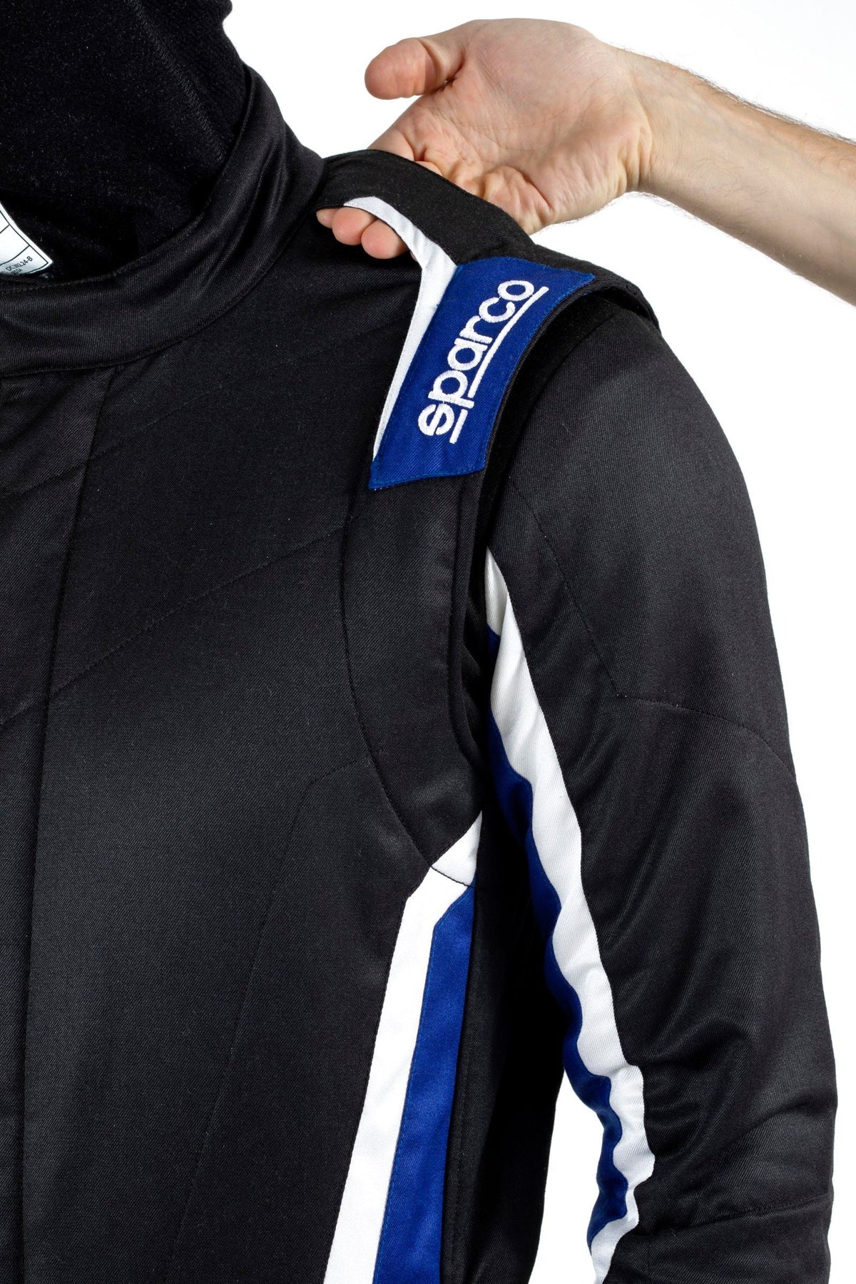 Black racing suit shoulder close-up with blue Sparco stripe detail