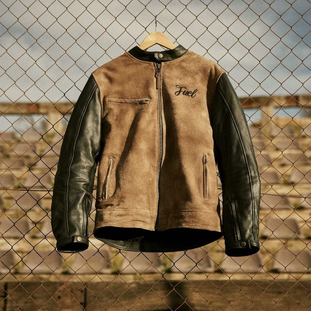 Fuel Sidewaze leather jacket, front view, with a tan body, black sleeves, zip pockets, and chest logo.