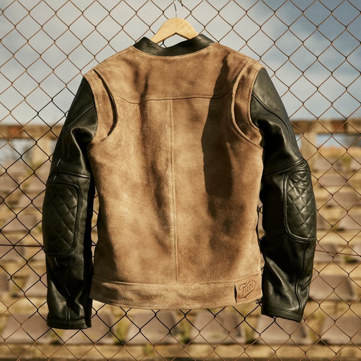 Fuel Sidewaze leather jacket back, with a tan panel and black leather sleeves with quilted elbows.