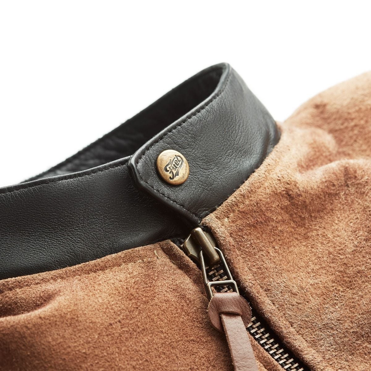 Close-up of the jacket's black leather collar, branded snap, and front zipper