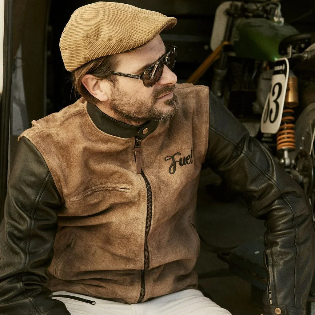 Model wearing the tan and black Fuel leather jacket with zip front and stand collar