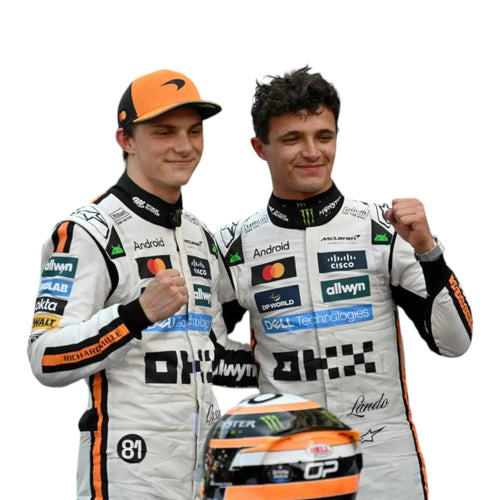 Matching white racing suits with orange trim and sponsor patches, two drivers standing